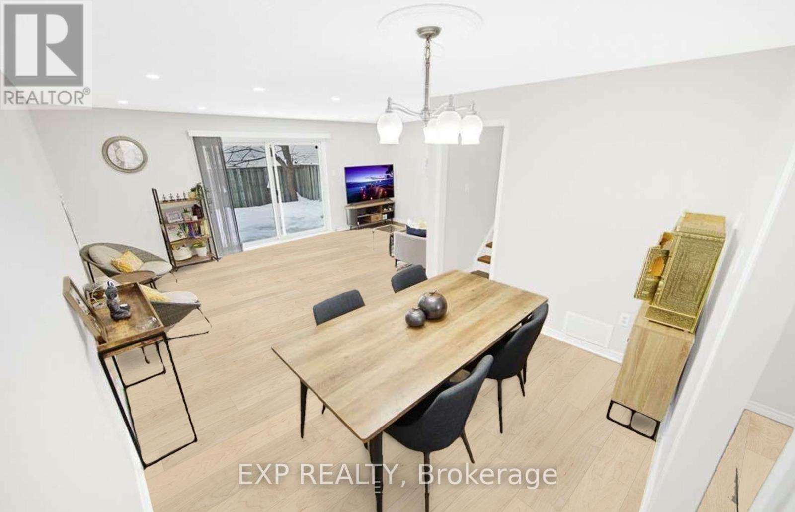 A dining room with a wooden table and chairs.