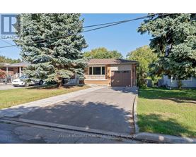 A house with a brown garage door is for sale.