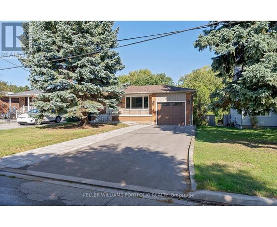 A house with a brown garage door is for sale.