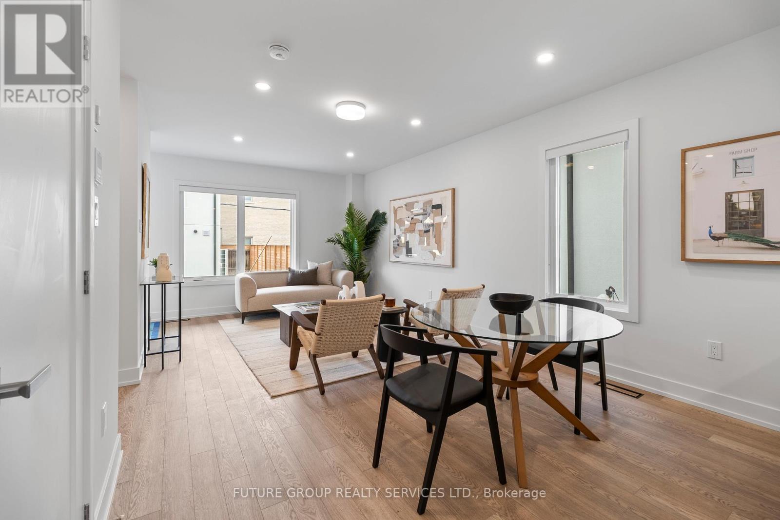 A dining room with a glass table and chairs.