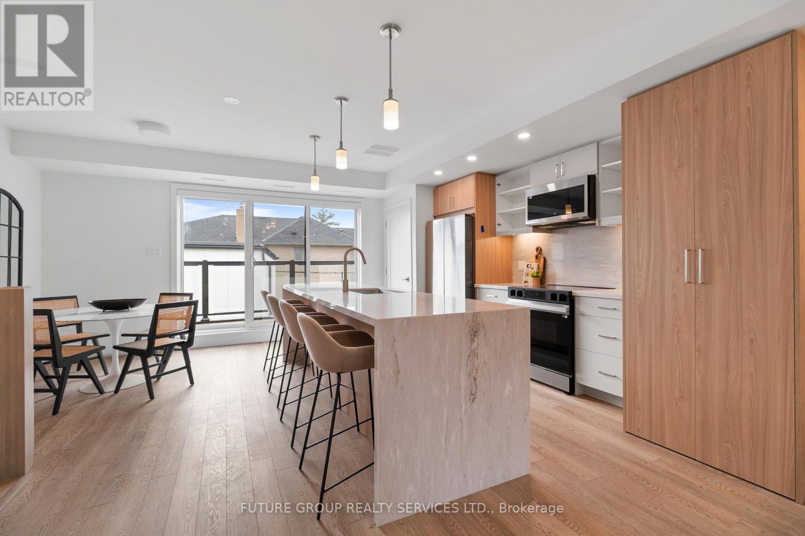 A modern kitchen with wooden cabinets and a large island.