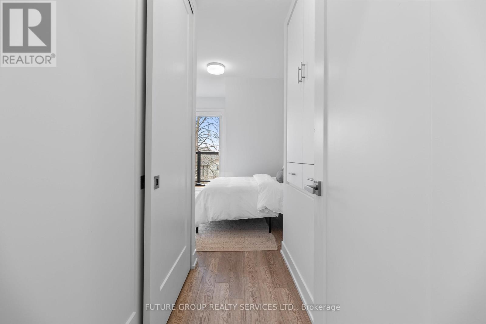 A bedroom with a bed and a window.