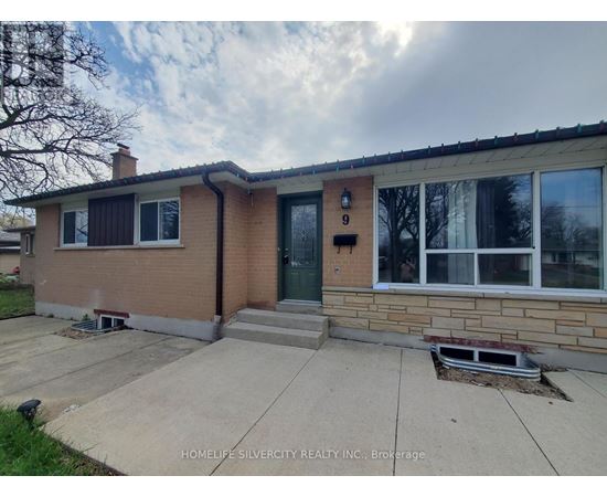 A house with a brick facade and a green door is for sale.
