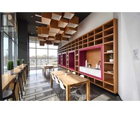 A modern dining area with wooden tables and chairs.