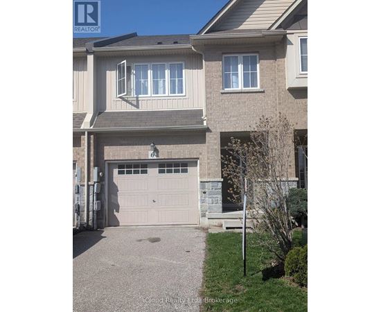 A house with a grey garage door and a brown roof.