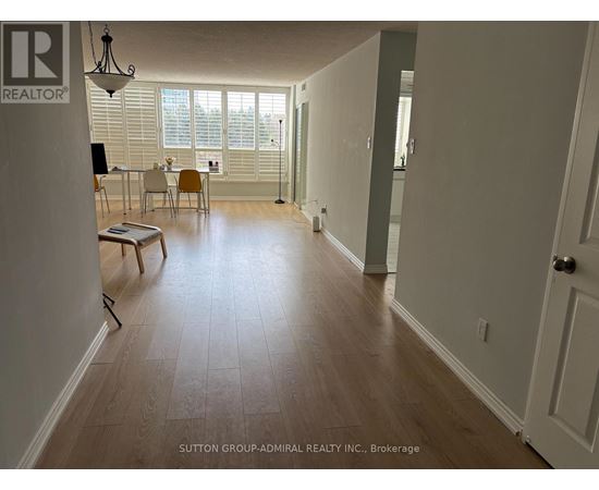 A room with a dining table and chairs in it.