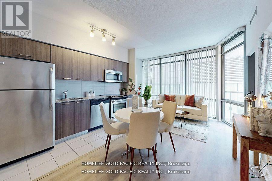 A modern kitchen with a dining table set up.