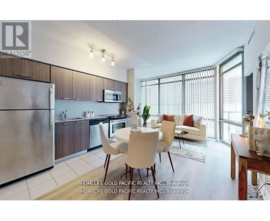 A modern kitchen with a dining table set up.