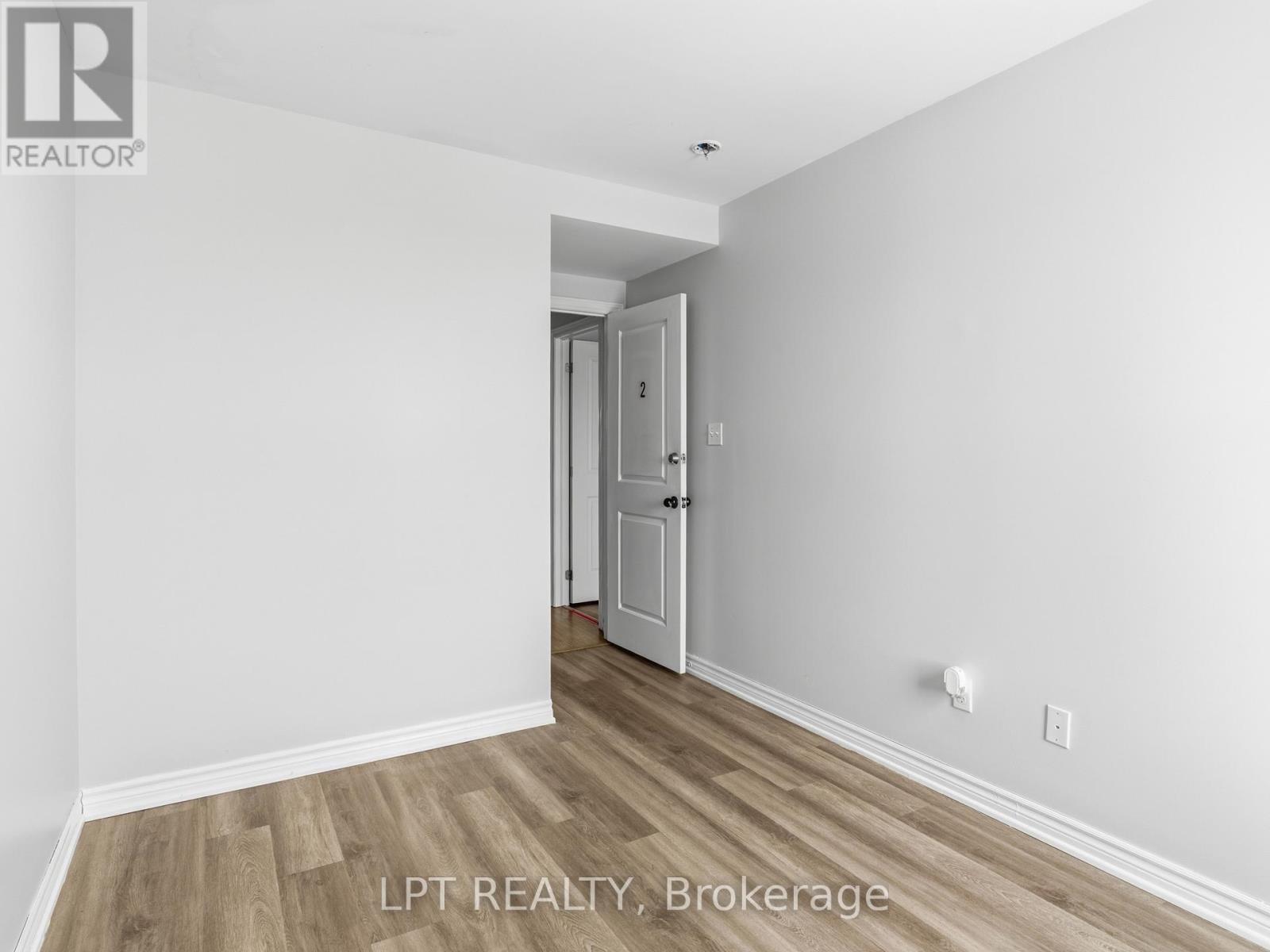 A room with a doorway leading to another room.