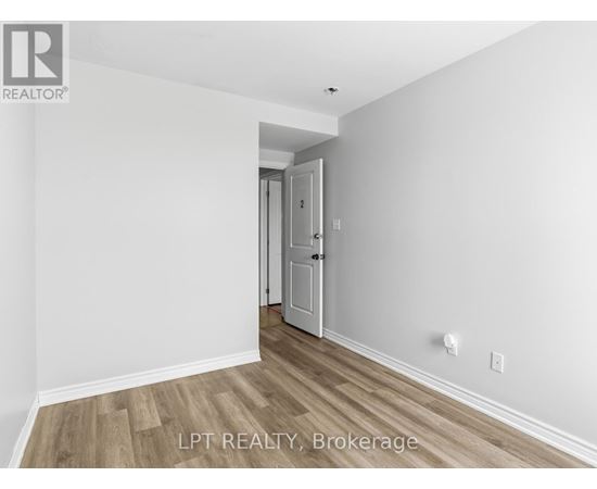 A room with a doorway leading to another room.
