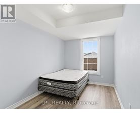 A bedroom with a bed and a window.
