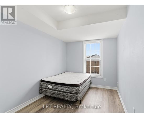 A bedroom with a bed and a window.