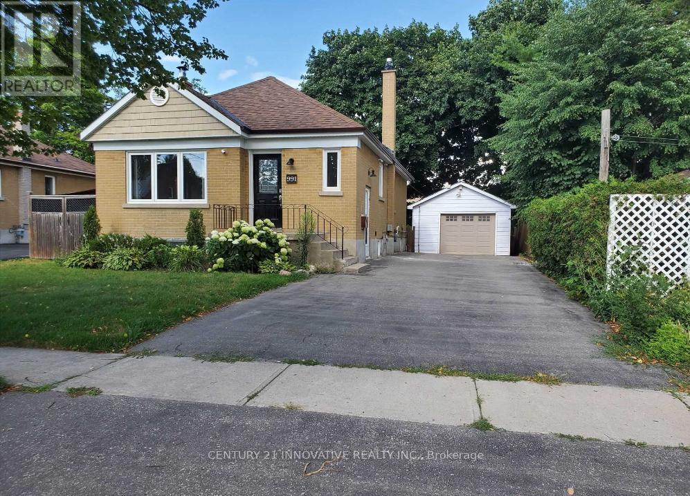 A house with a driveway in front of it.