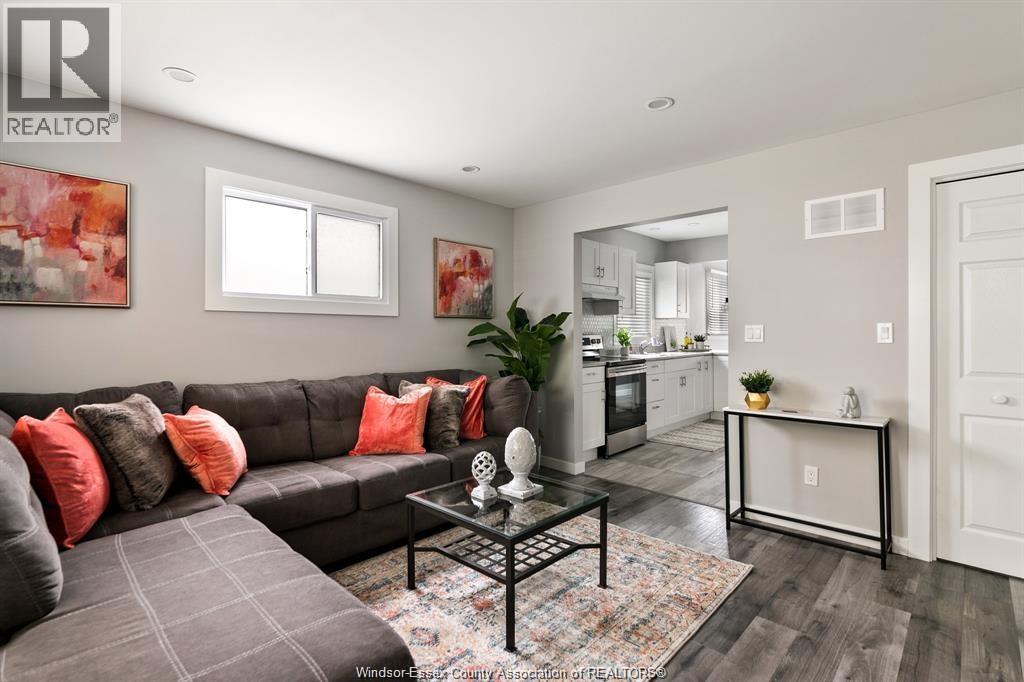 A living room with a grey couch and a coffee table.
