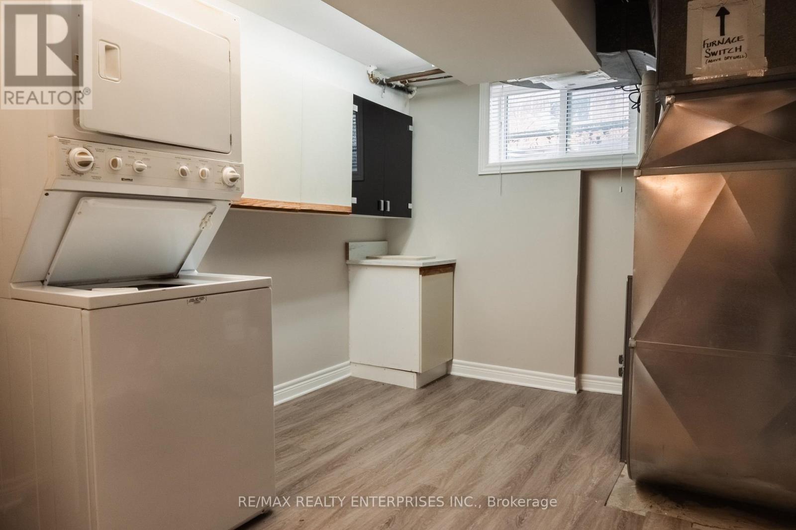 A small kitchen with a stove top oven and a microwave.