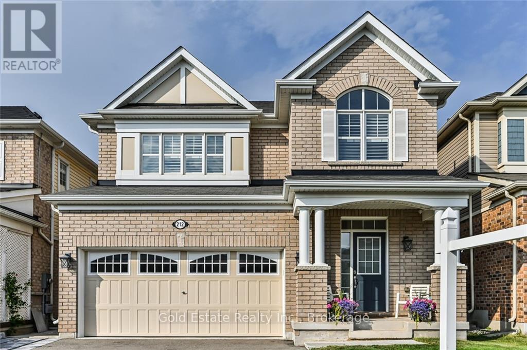 A two-story house with a garage is for sale.