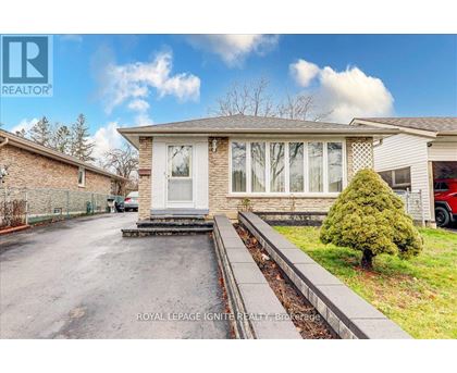 A house with a driveway in front of it.