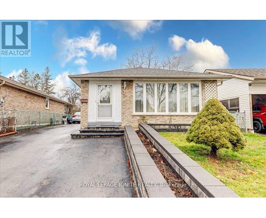 A house with a driveway in front of it.