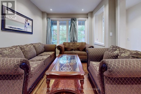 A living room with a brown coffee table and two sofas.