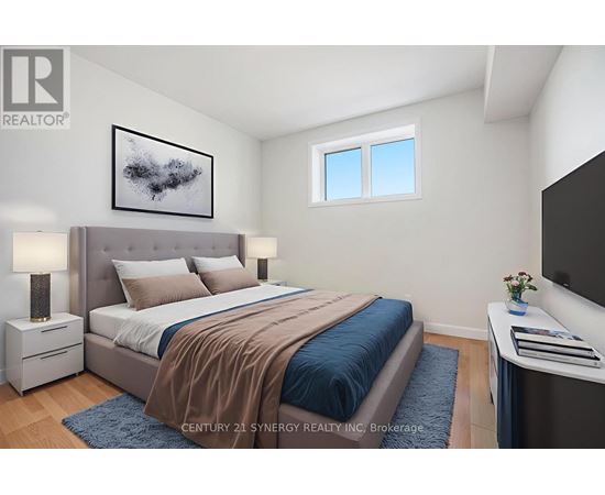 A bedroom with a large bed and a painting on the wall.