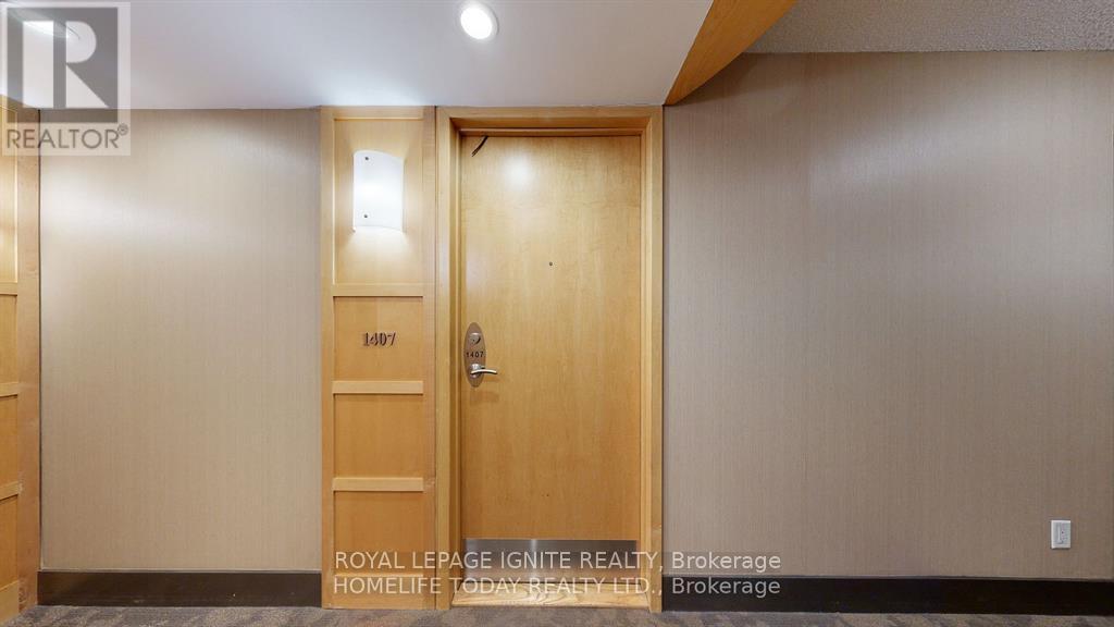 A wooden door with a glass window and a handle.