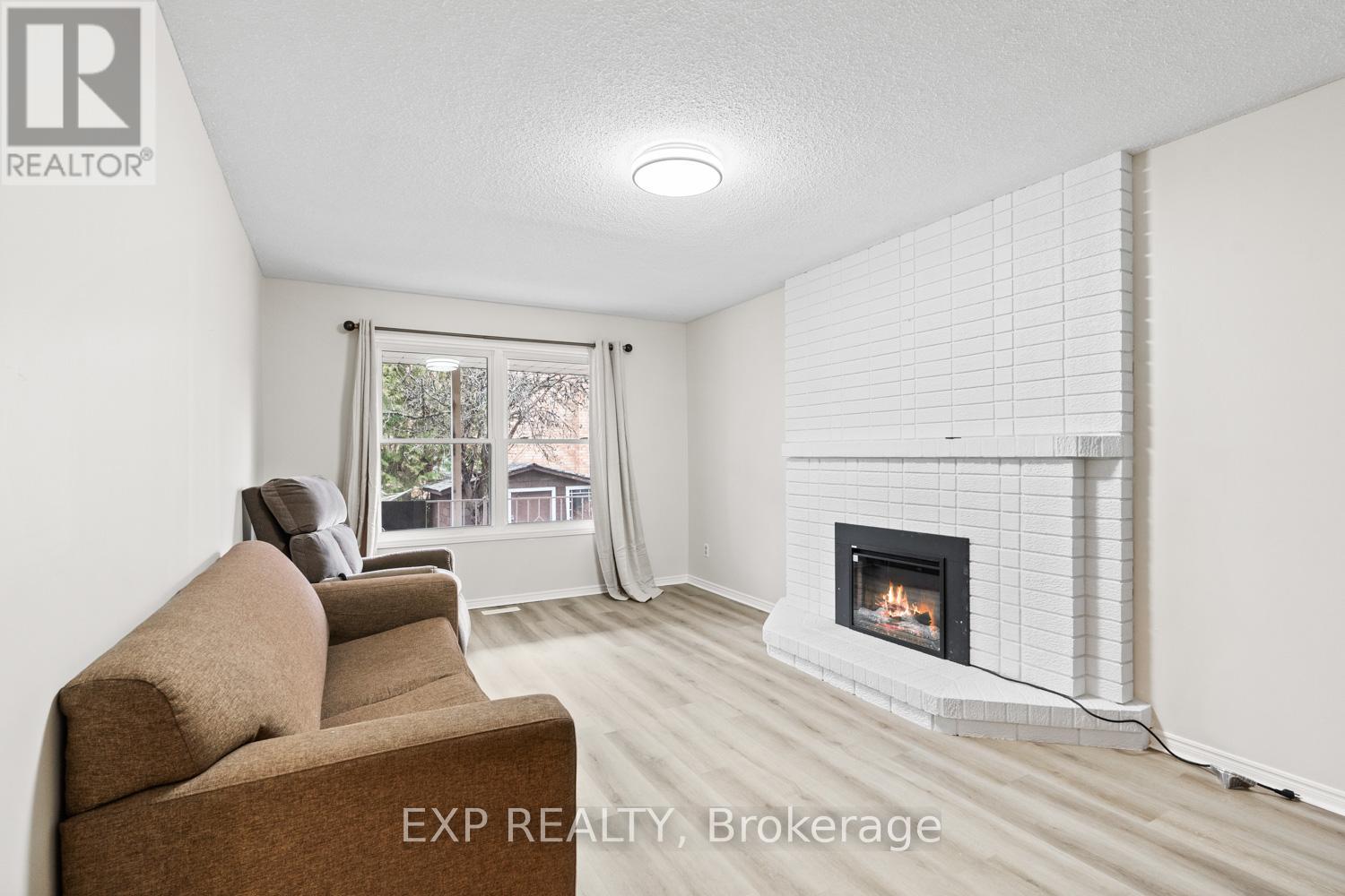 A living room with a fireplace and a couch.
