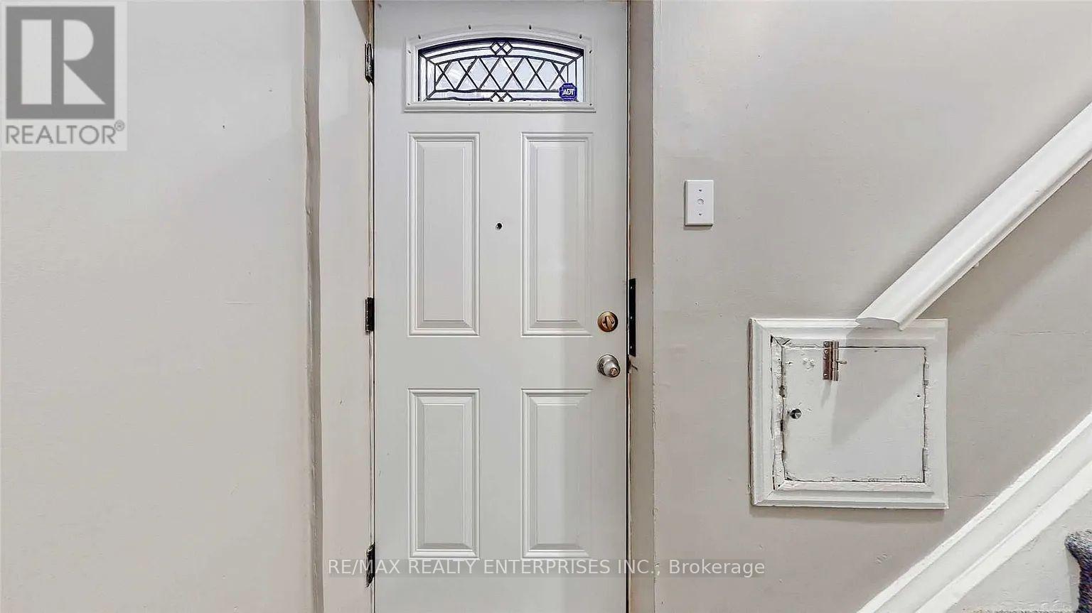 A white door with a glass window above it.
