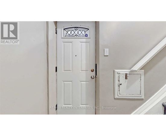 A white door with a glass window above it.