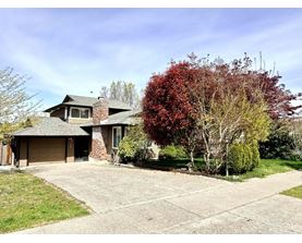 A house with a garage and a driveway.