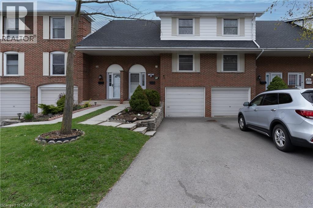 A house with a car parked in front of it.