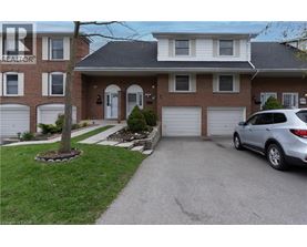 A house with a car parked in front of it.