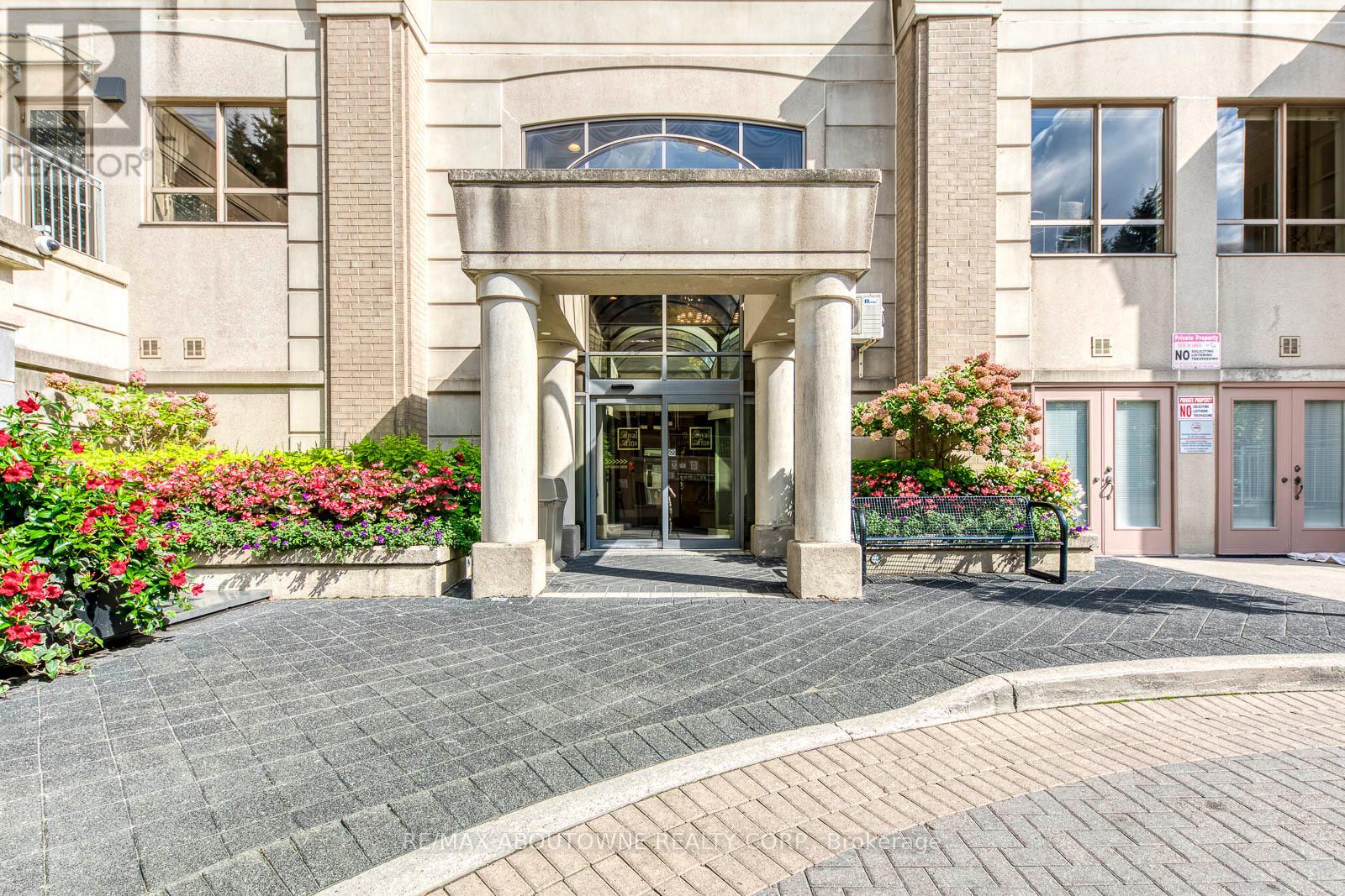 A building with a grey facade and a large entrance.