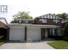 A house with a white garage door is for sale.