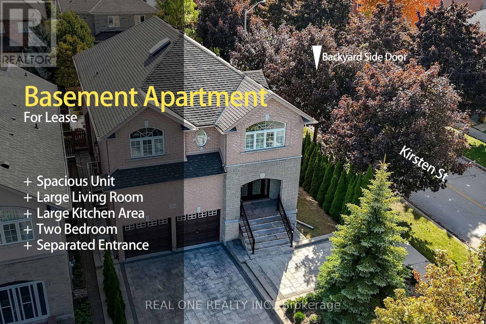 An aerial view of a basement apartment for lease, featuring a spacious unit, large living room, large kitchen area, two bedrooms, and a separated entrance.