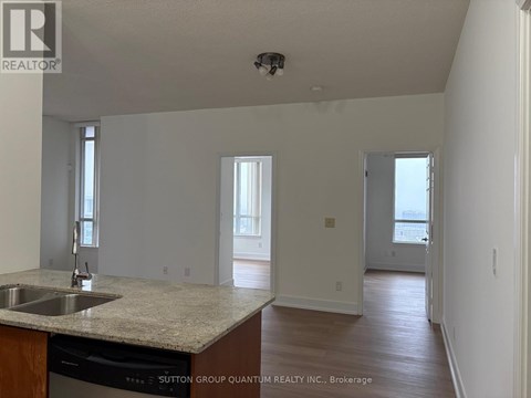 A kitchen with a sink and a counter top.