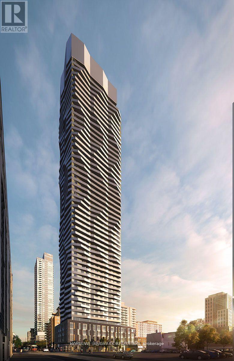 A tall, modern building with a curved facade is the focal point of the image.