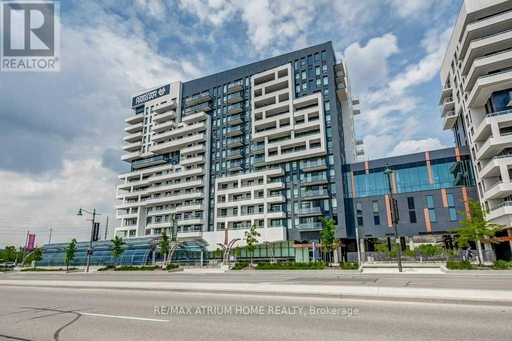 A modern multi-story building with the name "RE/MAX ATRIUM HOME REALTY, Brokerage" on the side.