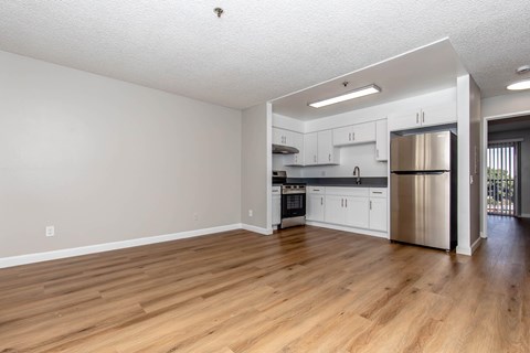 A kitchen with white cabinets and stainless steel appliances.