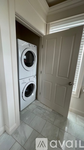 A washer and dryer in a laundry room.