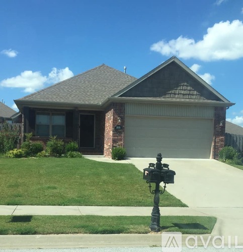 A house with a black mailbox in front of it.