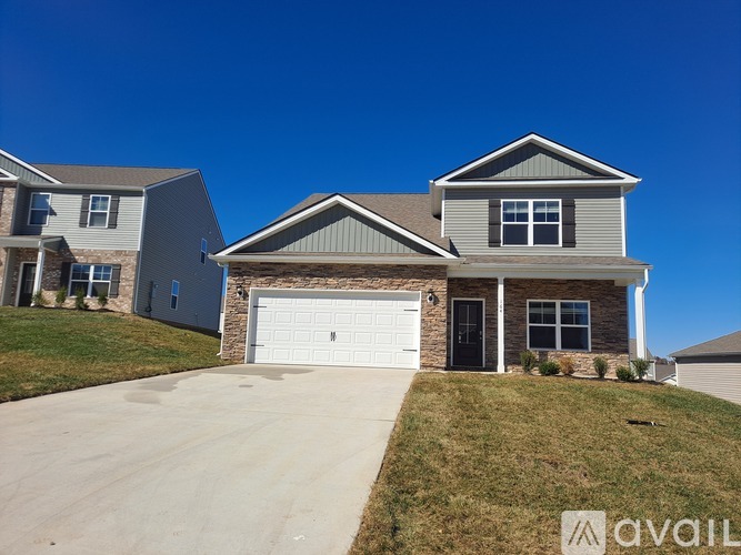 A house with a garage is for sale.