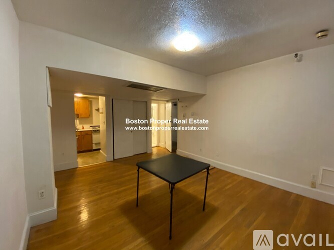 A room with a table and chairs in it.