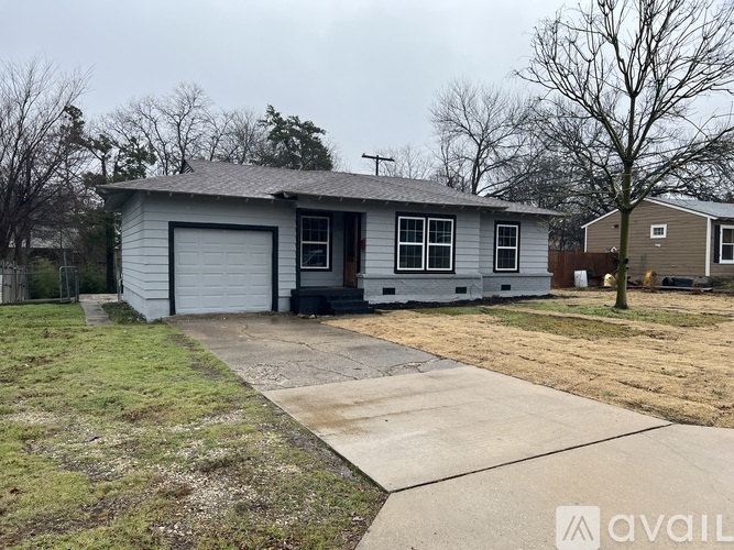 A house with a garage is available for sale.