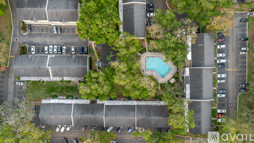 A parking lot with a pool in the middle of it.
