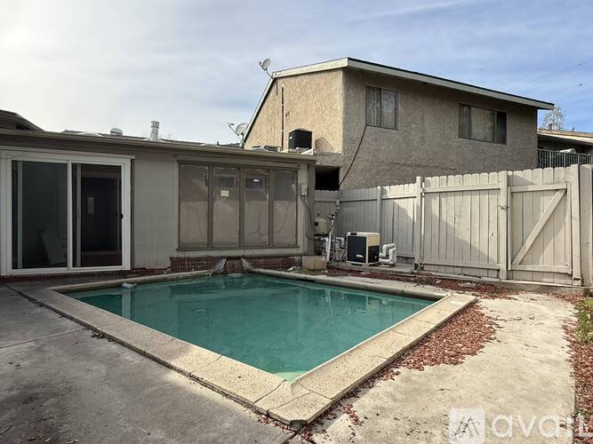 A house with a pool in the backyard.
