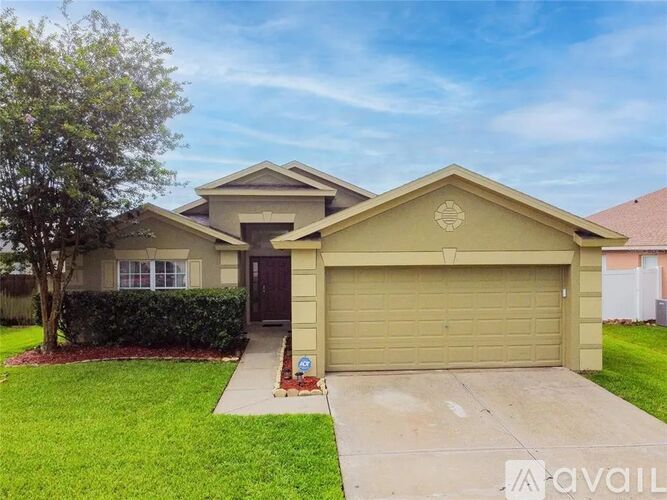 A house with a brown garage door is for sale.