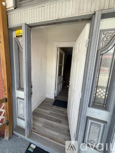 A doorway with a glass window and a wooden frame.