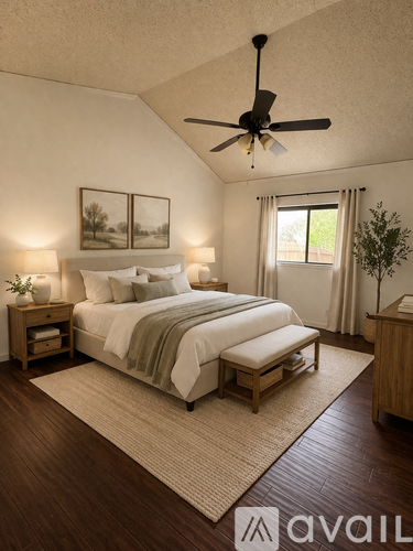 A bedroom with a bed, nightstands, and a ceiling fan.