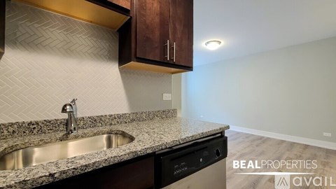 A kitchen with a sink and a countertop.