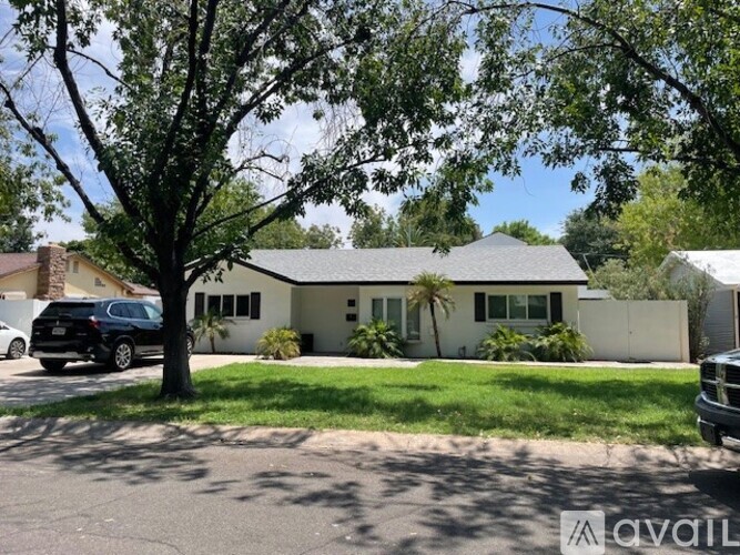 A house with a tree in front of it.